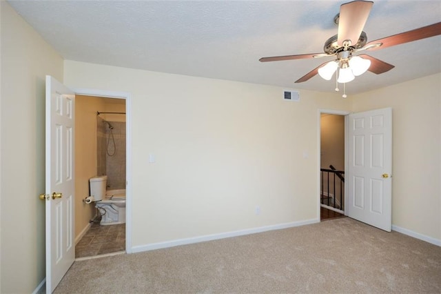 unfurnished bedroom with light carpet and ceiling fan