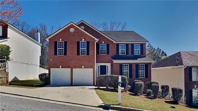 colonial inspired home with concrete driveway, an attached garage, brick siding, and a front lawn