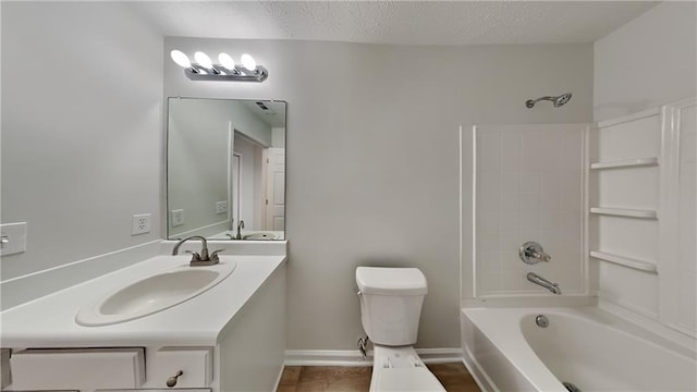 bathroom with toilet, a textured ceiling, baseboards, bathtub / shower combination, and vanity