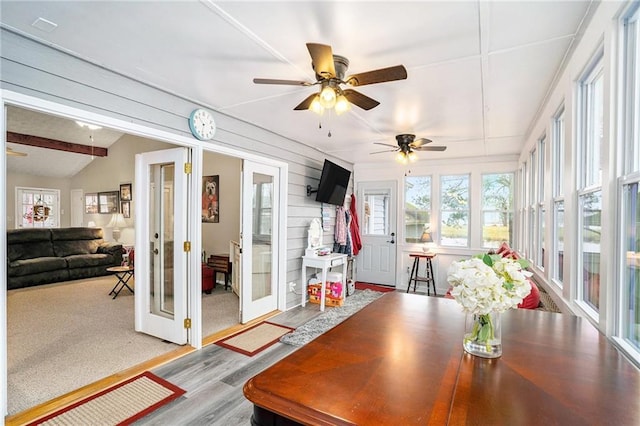 sunroom featuring french doors and wood finished floors
