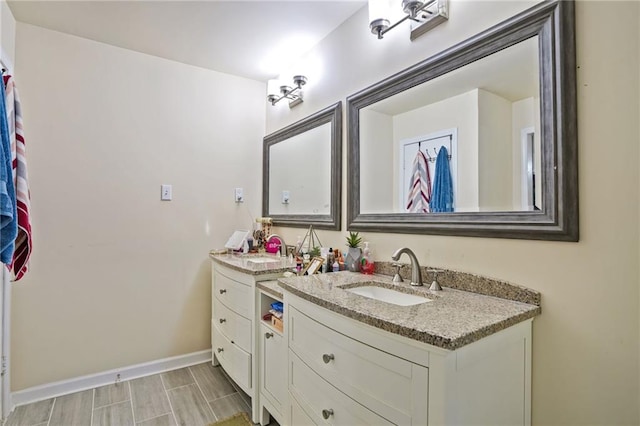 4025 Cheoah Dr, Douglasville, GA 30135 - bathroom with vanity and baseboards