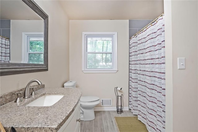 4025 Cheoah Dr, Douglasville, GA 30135 - full bath featuring vanity, plenty of natural light, toilet, and baseboards