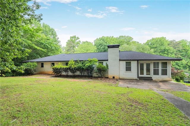 4025 Cheoah Dr, Douglasville, GA 30135 - rear view of property with french doors, a lawn, and a chimney