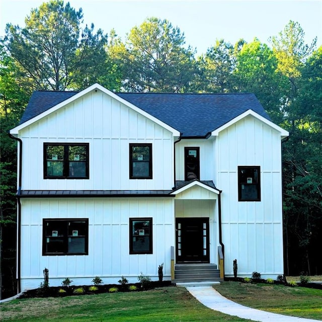 25 Hollow Oak Ct, Newnan, GA 30263 - modern inspired farmhouse featuring roof with shingles, a standing seam roof, a front lawn, metal roof, and board and batten siding