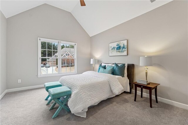 bedroom featuring vaulted ceiling, ceiling fan, carpet flooring, and baseboards