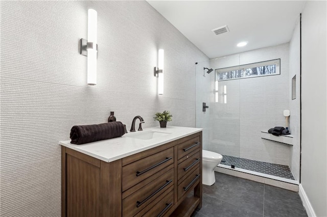 bathroom featuring a walk in shower, toilet, vanity, visible vents, and tile patterned floors