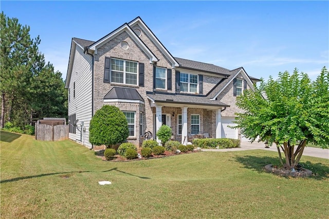 view of front facade with a front yard and a garage