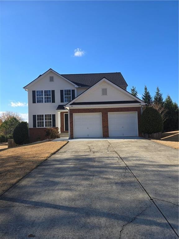 front of property with a garage