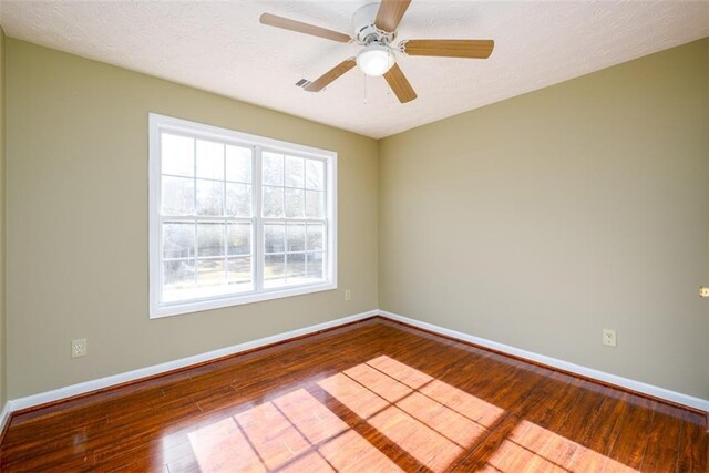 1188 Pine Acre Dr, Sugar Hill, GA 30518 - unfurnished room with hardwood / wood-style floors, baseboards, ceiling fan, and a textured ceiling