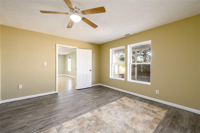 1188 Pine Acre Dr, Sugar Hill, GA 30518 - empty room featuring wood finished floors, baseboards, and ceiling fan