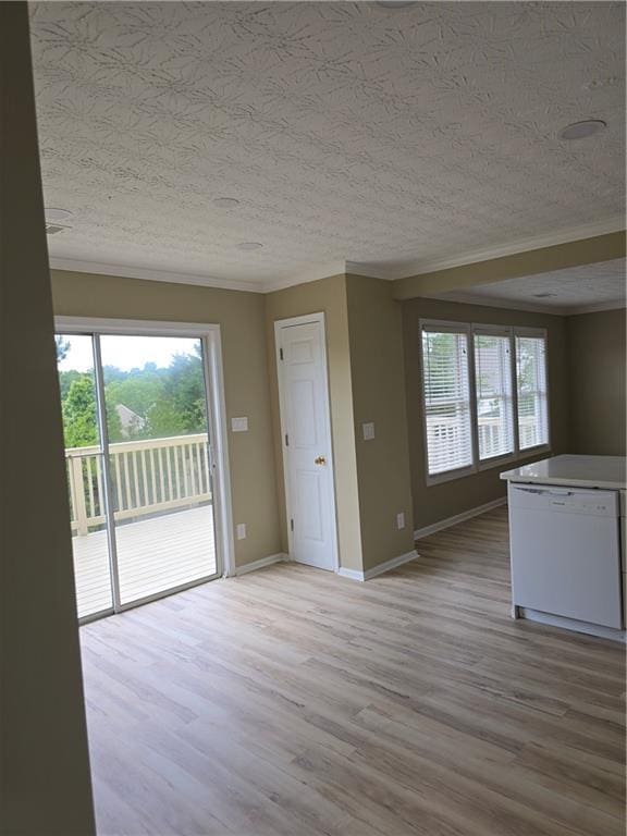 1188 Pine Acre Dr, Sugar Hill, GA 30518 - unfurnished living room with crown molding, a textured ceiling, light wood-type flooring, and baseboards