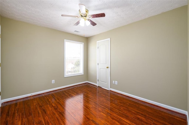 1188 Pine Acre Dr, Sugar Hill, GA 30518 - empty room with wood finished floors, baseboards, ceiling fan, and a textured ceiling