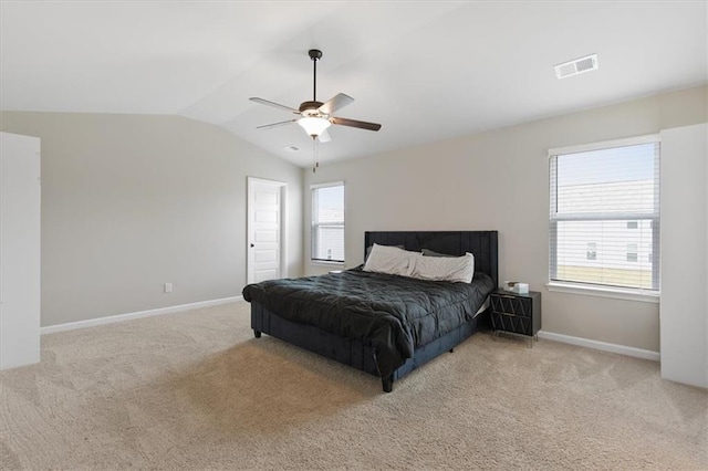 carpeted bedroom featuring lofted ceiling and ceiling fan