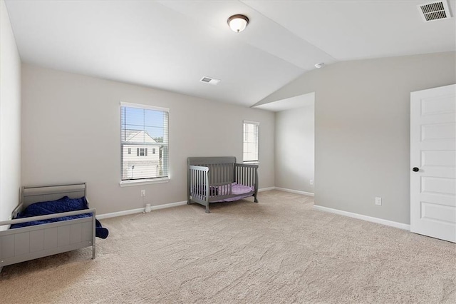 living area with lofted ceiling and light colored carpet