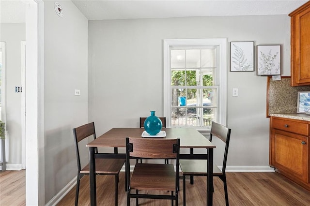 dining space featuring light hardwood / wood-style floors