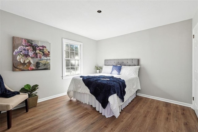 bedroom with hardwood / wood-style flooring