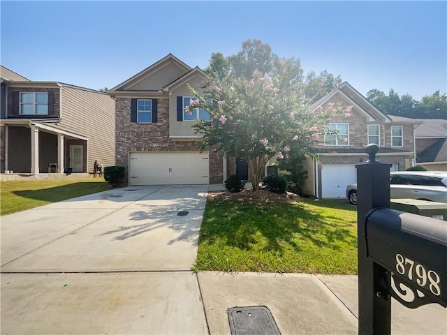 view of front of home with a garage and a front lawn