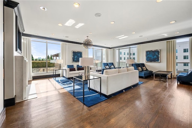 living room with hardwood / wood-style flooring, floor to ceiling windows, and a chandelier