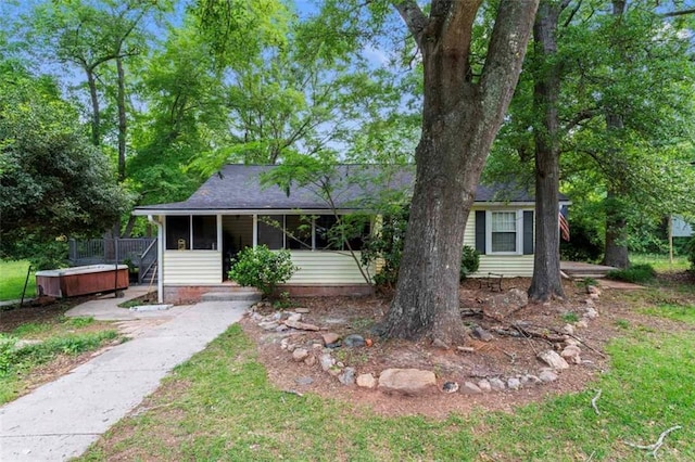 711 S Pine Hill Rd, Griffin, GA 30224 - view of front of home with a hot tub, a sunroom, and a shingled roof