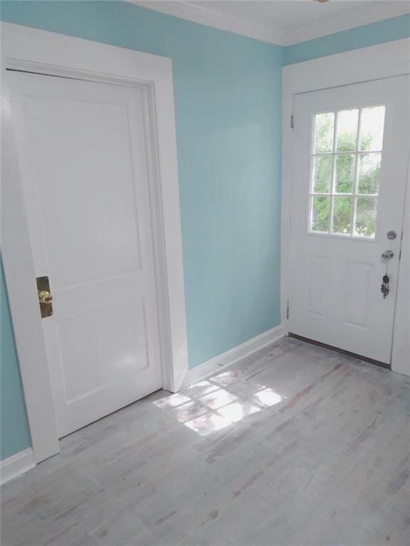 711 S Pine Hill Rd, Griffin, GA 30224 - doorway to outside featuring wood finished floors, ornamental molding, and baseboards