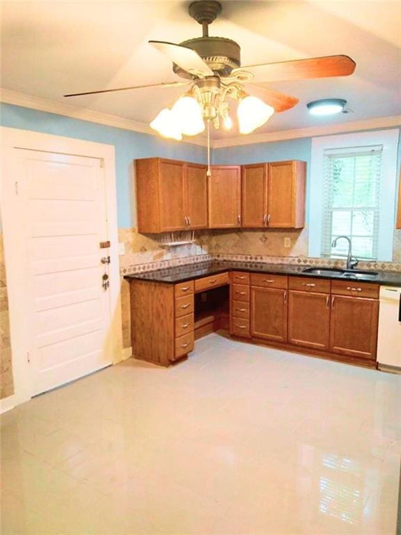 711 S Pine Hill Rd, Griffin, GA 30224 - kitchen with a sink, white dishwasher, crown molding, brown cabinets, and ceiling fan