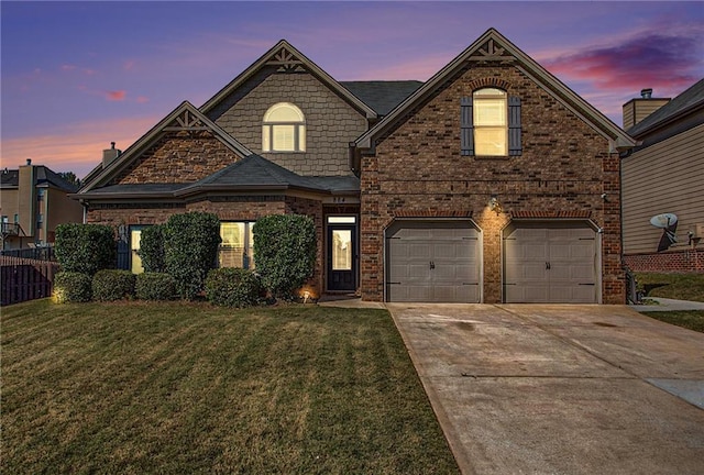 view of front of home featuring a yard and a garage