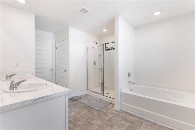 bathroom with independent shower and bath and vanity