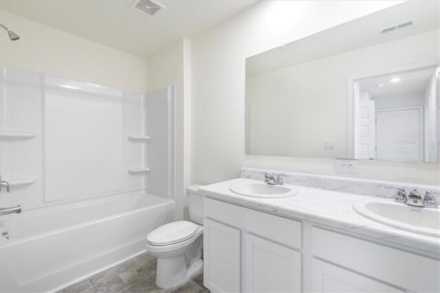 full bathroom featuring toilet, vanity, and shower / bathing tub combination