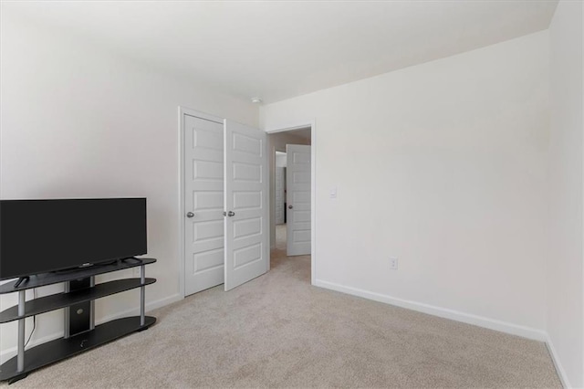 bedroom featuring light colored carpet