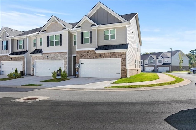 townhome / multi-family property featuring a garage