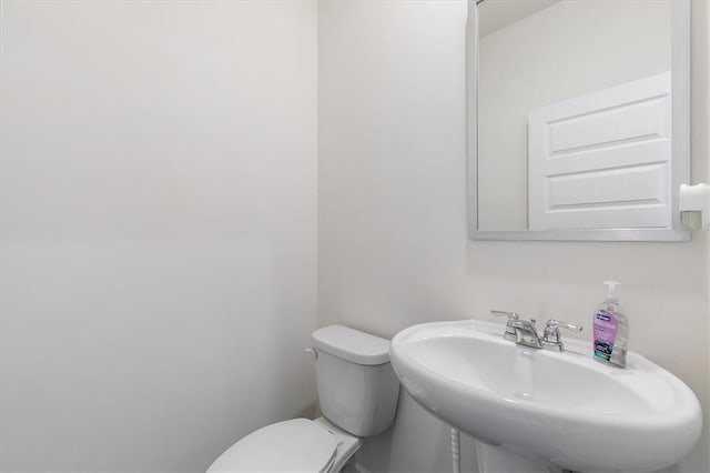 bathroom with sink and toilet