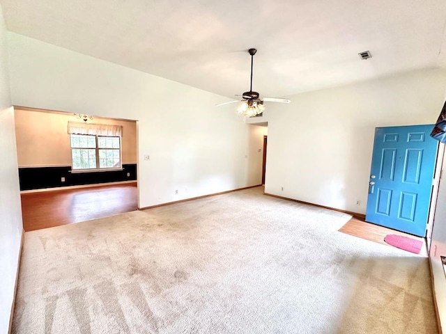 60 Parkman Trl, Covington, GA 30016 - unfurnished living room with carpet, ceiling fan, baseboards, and lofted ceiling