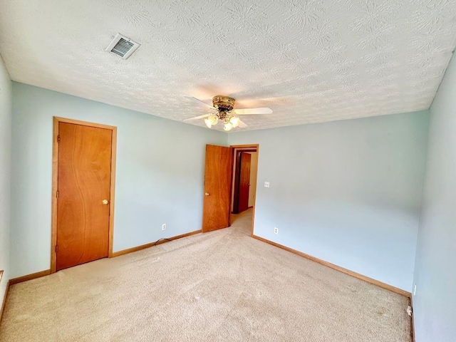 60 Parkman Trl, Covington, GA 30016 - unfurnished room featuring carpet, baseboards, ceiling fan, and a textured ceiling
