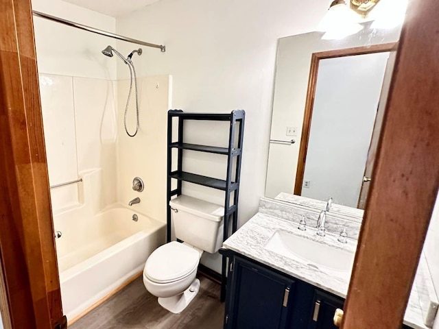 60 Parkman Trl, Covington, GA 30016 - bathroom featuring toilet, wood finished floors, vanity, and  shower combination
