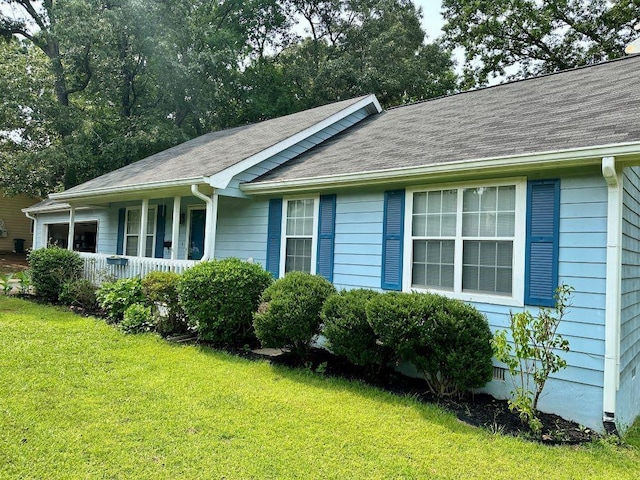 60 Parkman Trl, Covington, GA 30016 - single story home featuring a front lawn, a porch, and roof with shingles