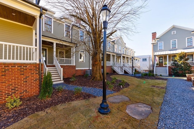 exterior space with cooling unit and a porch