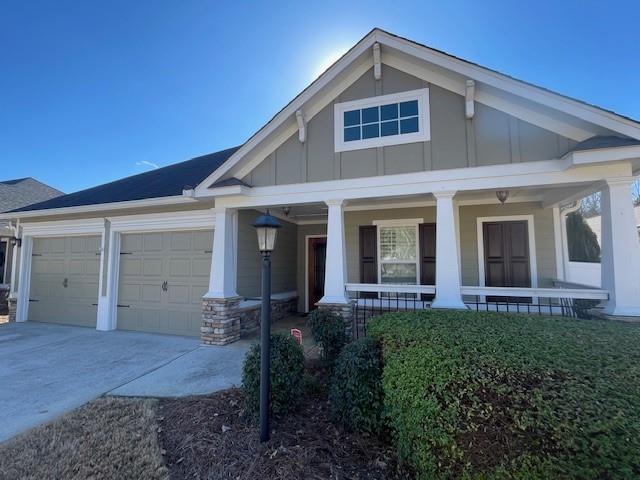 craftsman-style home with a garage and a porch