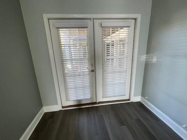 doorway with dark wood-type flooring and french doors