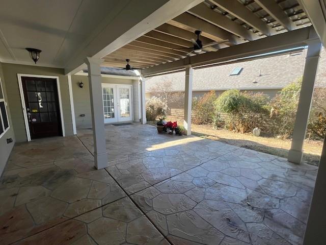 view of patio featuring french doors and ceiling fan