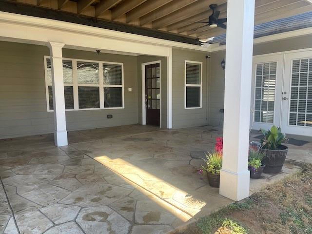 view of patio / terrace featuring ceiling fan and french doors