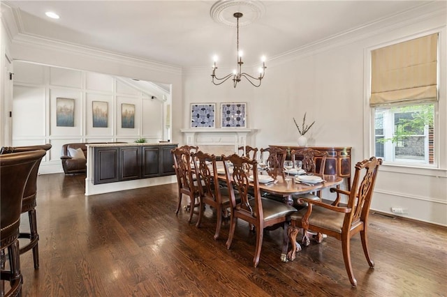 dining space with visible vents, crown molding, a chandelier, a decorative wall, and dark wood-type flooring