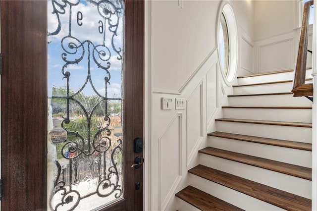 stairs featuring a decorative wall