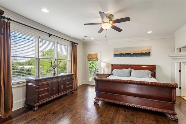 bedroom with dark wood-type flooring, baseboards, and crown molding