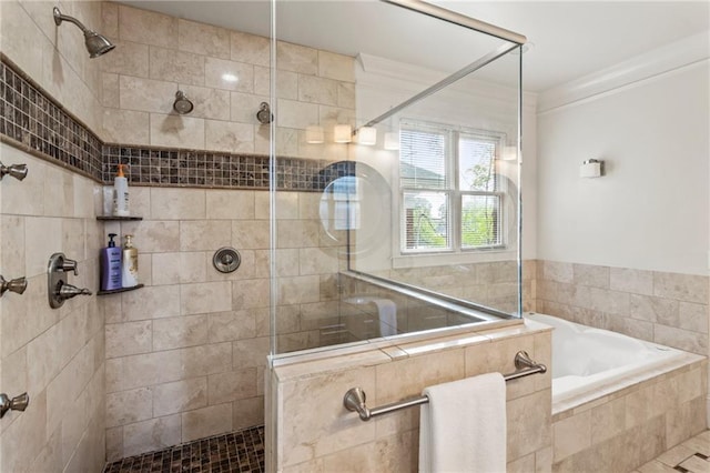 bathroom featuring a walk in shower and a garden tub