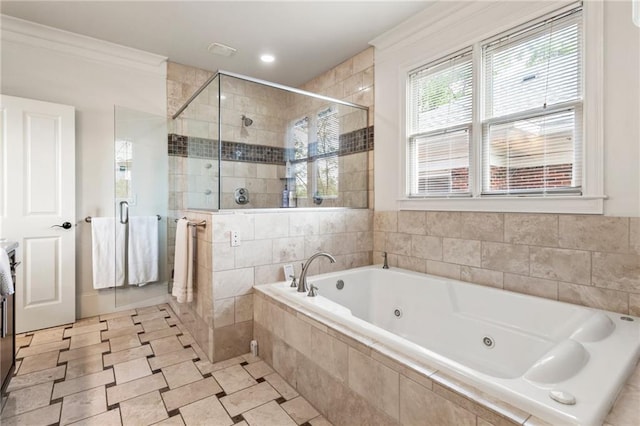 bathroom with a whirlpool tub, ornamental molding, and a stall shower