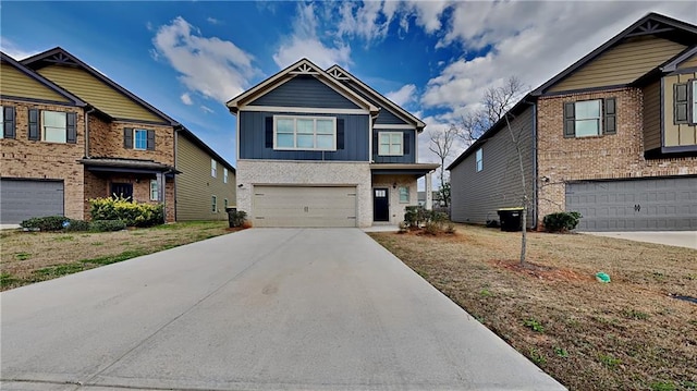 craftsman house with a garage, driveway, board and batten siding, and brick siding