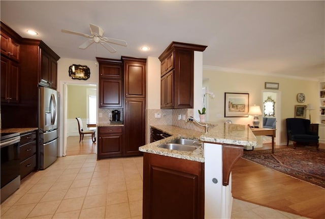 340 Channings Lake Dr, Lawrenceville, GA 30043 - kitchen with stainless steel appliances, a peninsula, light tile patterned flooring, a ceiling fan, and backsplash