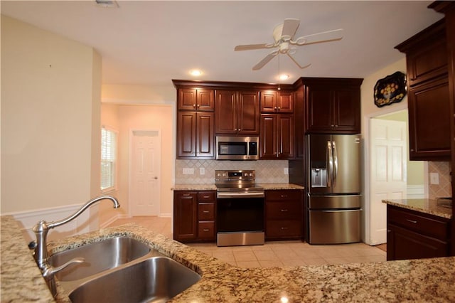 340 Channings Lake Dr, Lawrenceville, GA 30043 - kitchen featuring stainless steel appliances, light tile patterned floors, decorative backsplash, a ceiling fan, and recessed lighting