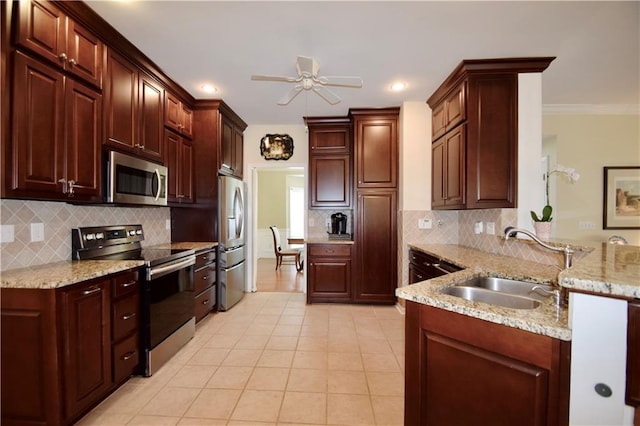 340 Channings Lake Dr, Lawrenceville, GA 30043 - kitchen with stainless steel appliances, a peninsula, backsplash, a ceiling fan, and light tile patterned floors