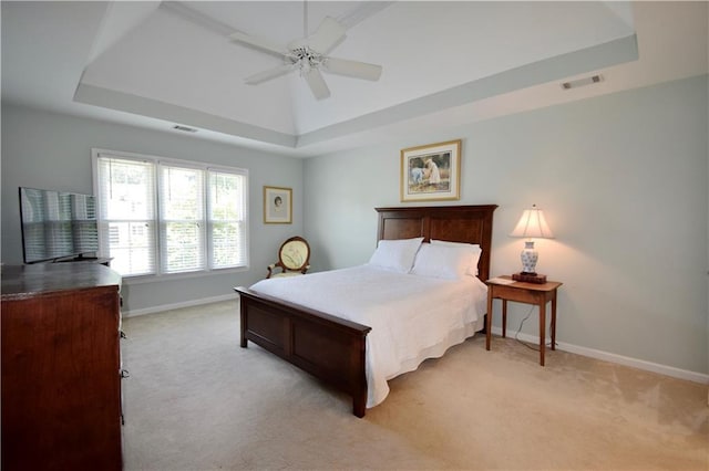 340 Channings Lake Dr, Lawrenceville, GA 30043 - bedroom with a tray ceiling, light colored carpet, and ceiling fan